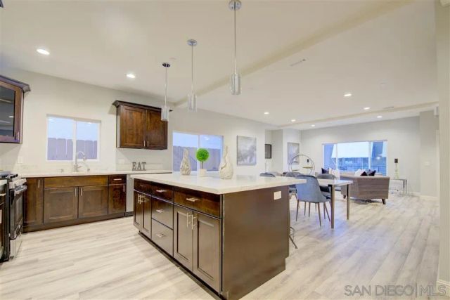 a kitchen with lots of counter top space and appliances