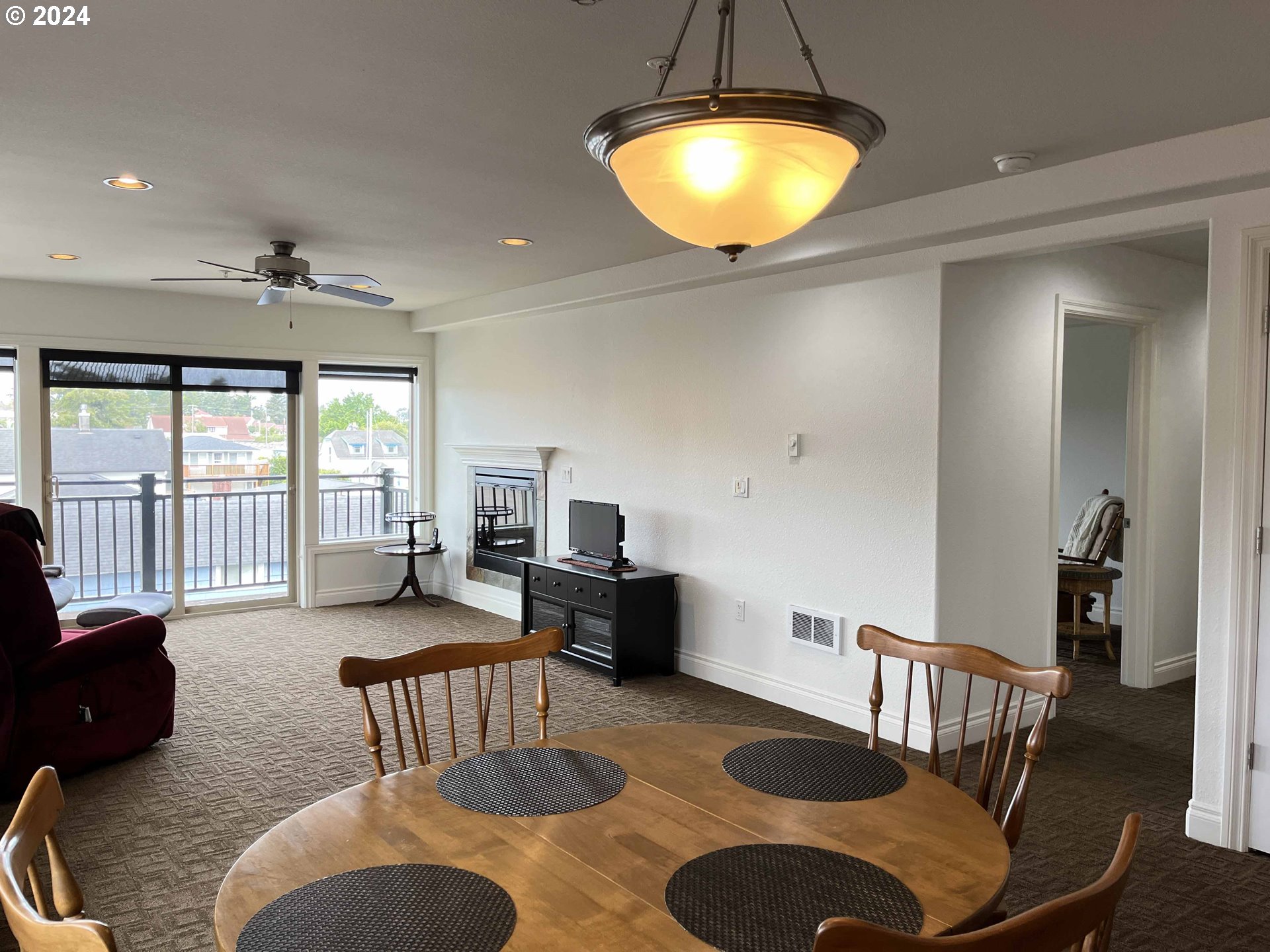 211 Harbor Street, Unit 31 Florence, OR 97439 - Photo 12 of 44 a living room with furniture and a large window