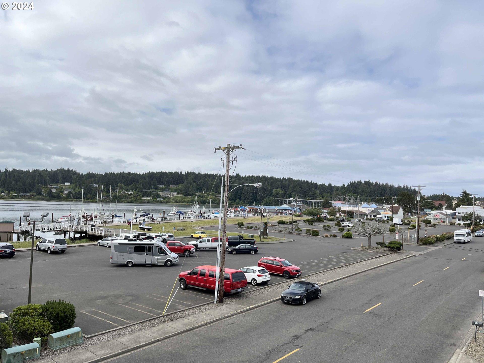 211 Harbor Street, Unit 31 Florence, OR 97439 - Photo 20 of 44 a view of a city street with cars