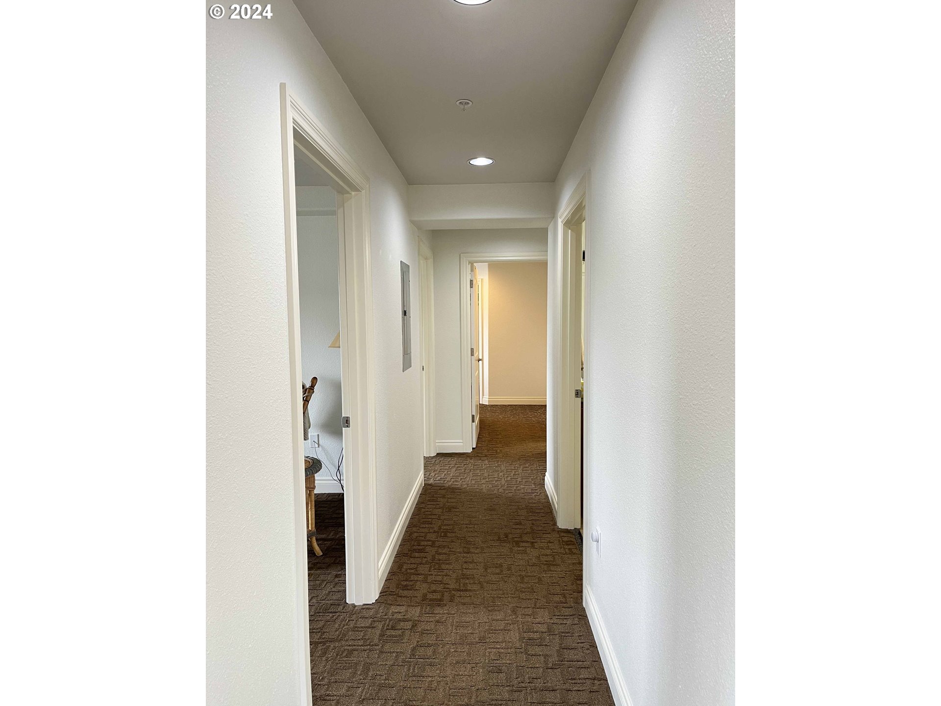 211 Harbor Street, Unit 31 Florence, OR 97439 - Photo 23 of 44 a view of a hallway with wooden floor