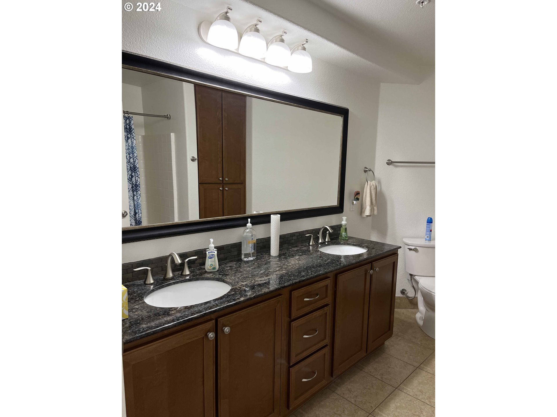 211 Harbor Street, Unit 31 Florence, OR 97439 - Photo 26 of 44 a bathroom with a granite countertop sink and a mirror