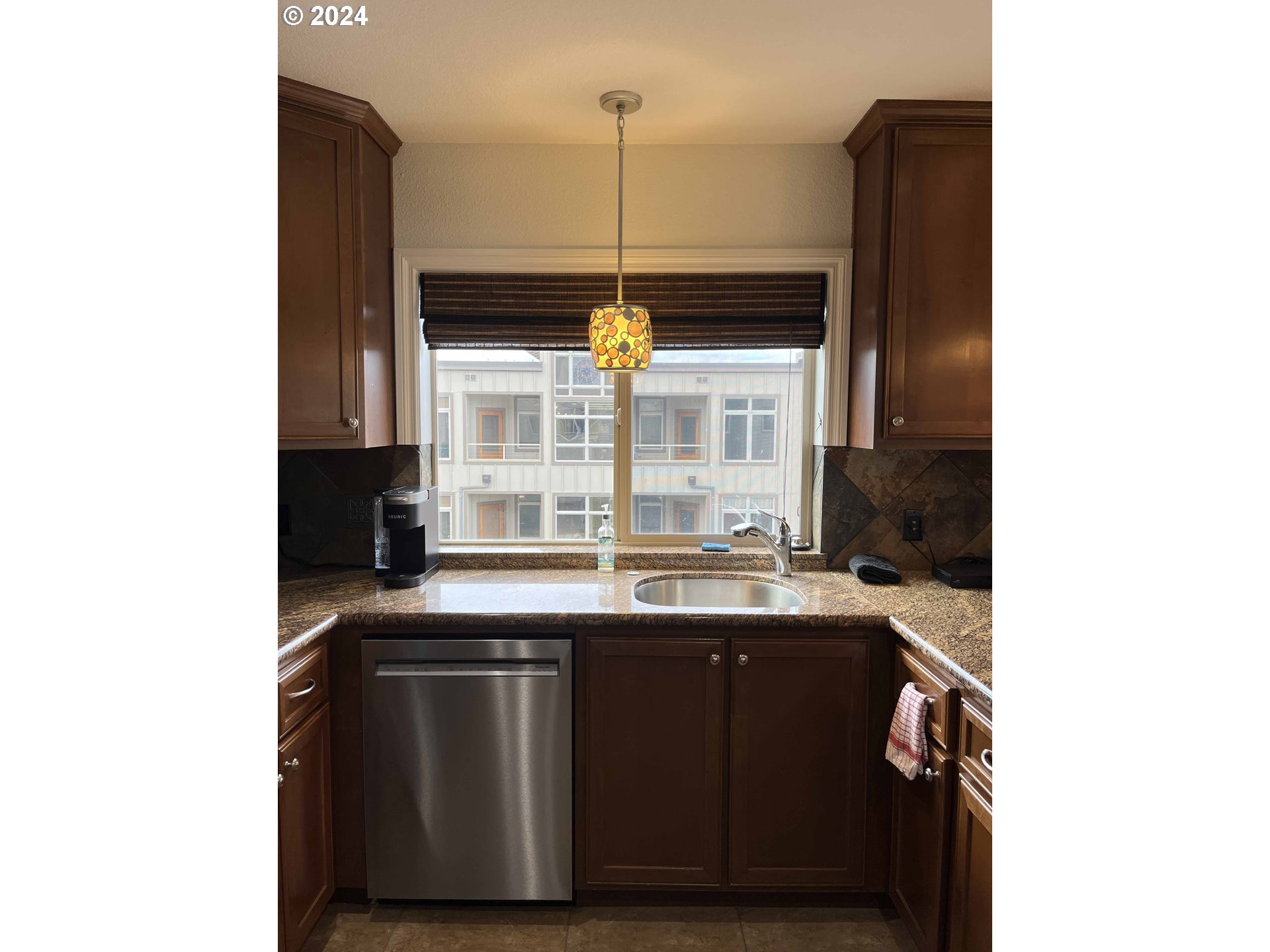 211 Harbor Street, Unit 31 Florence, OR 97439 - Photo 9 of 44 a kitchen with a sink and a window