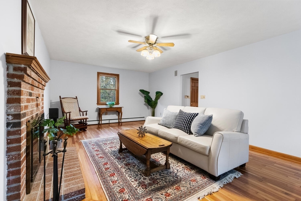 11 Simonds Farm Road Billerica, MA 01862 - Photo 19 of 42 a living room with furniture a chandelier and a rug