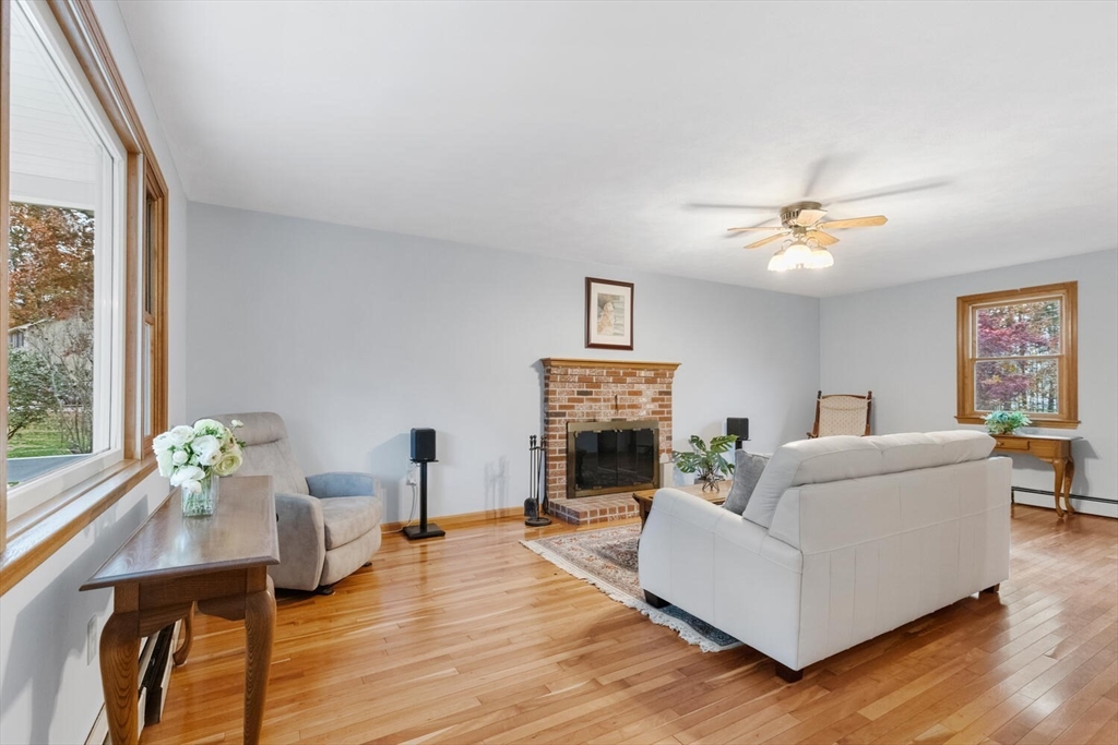 11 Simonds Farm Road Billerica, MA 01862 - Photo 20 of 42 a living room with furniture and a fireplace