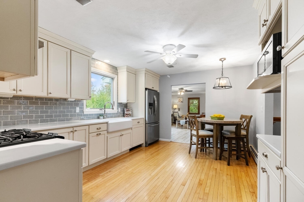 11 Simonds Farm Road Billerica, MA 01862 - Photo 26 of 42 a view of a dining room with furniture and wooden floor