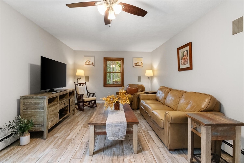 11 Simonds Farm Road Billerica, MA 01862 - Photo 30 of 42 a living room with furniture and a flat screen tv
