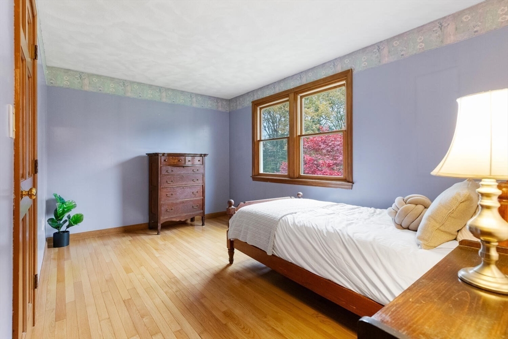 11 Simonds Farm Road Billerica, MA 01862 - Photo 40 of 42 a bedroom with a bed and a lamp on dresser