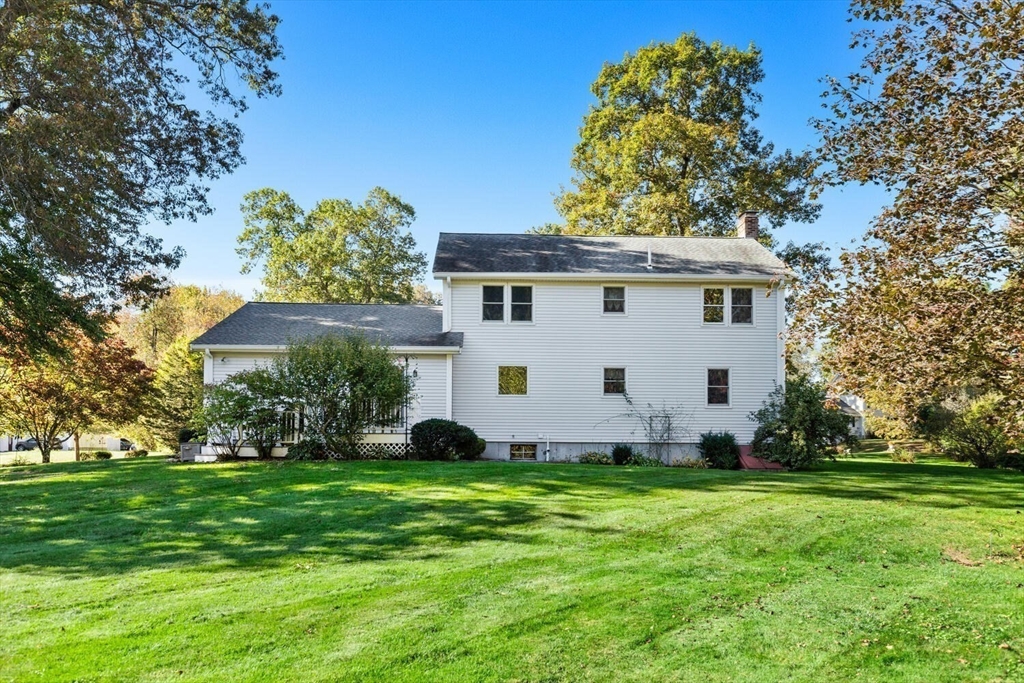 11 Simonds Farm Road Billerica, MA 01862 - Photo 42 of 42 a view of a white house with a yard and potted plants