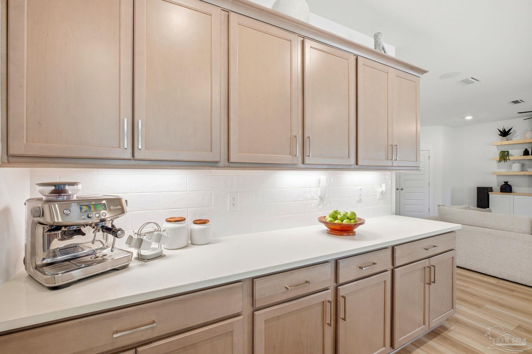 6228 Dry Crk Road Molino, FL 32577 - Photo 17 of 64 a kitchen with stainless steel appliances granite countertop white cabinets and a sink