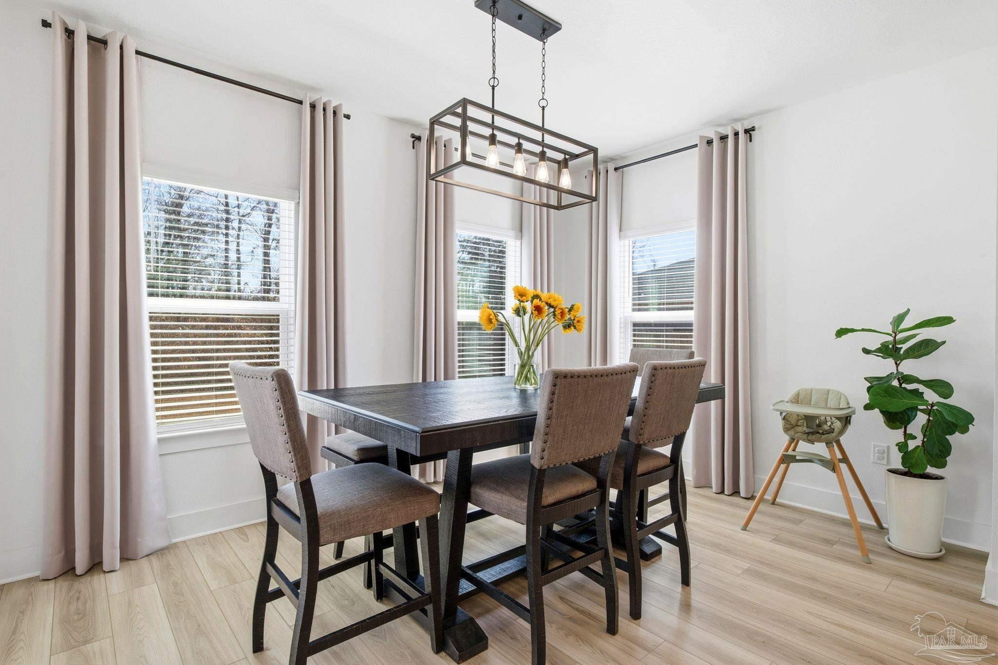 6228 Dry Crk Road Molino, FL 32577 - Photo 19 of 64 a view of a dining room with furniture window and wooden floor