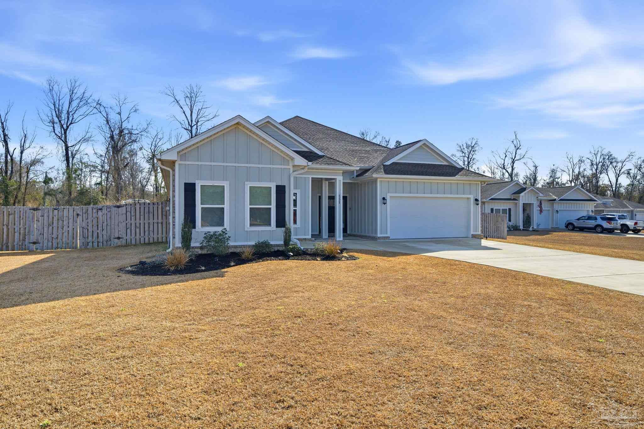 6228 Dry Crk Road Molino, FL 32577 - Photo 2 of 64 a view of a house with a yard and wooden fence