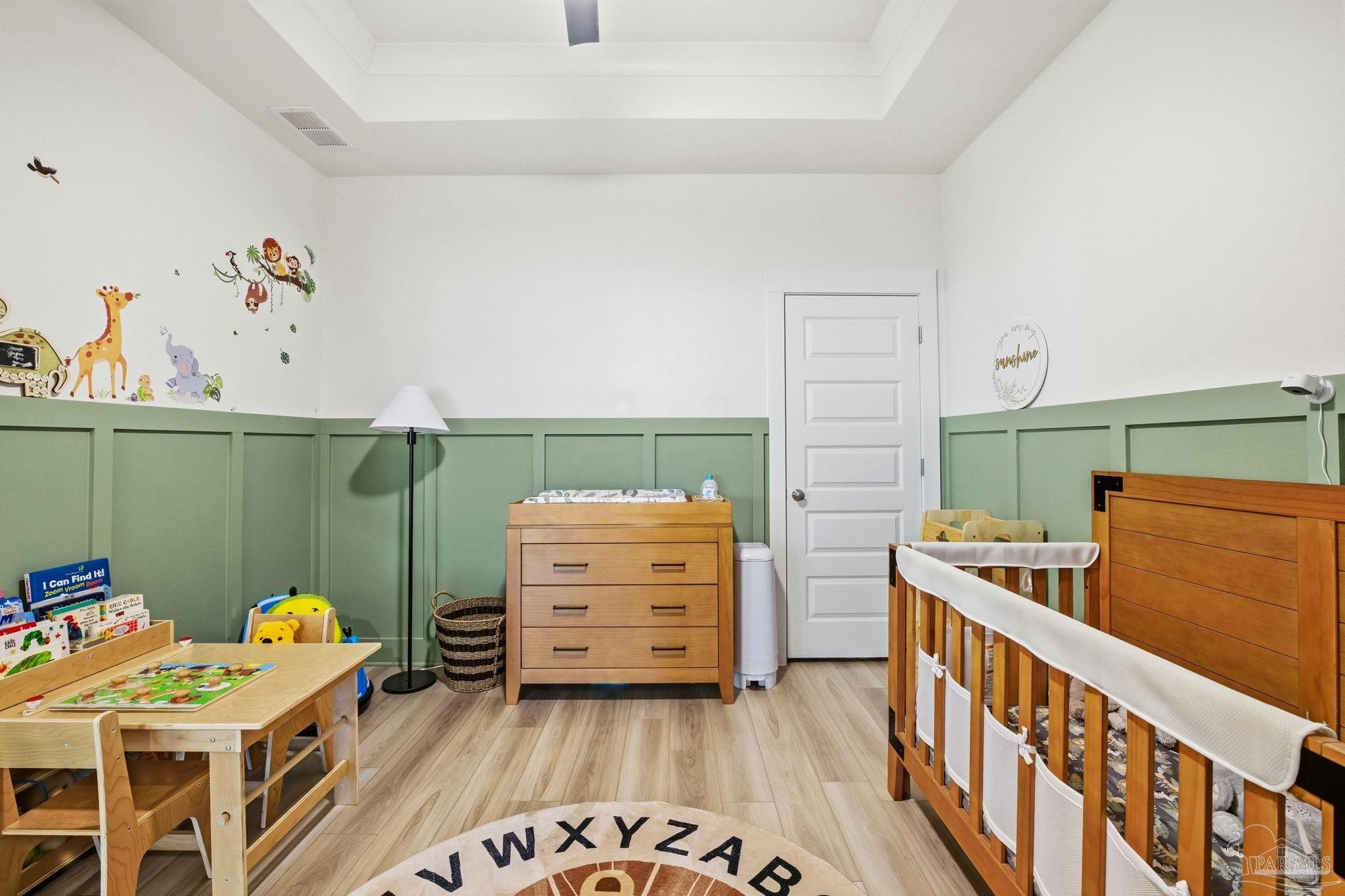 6228 Dry Crk Road Molino, FL 32577 - Photo 29 of 64 a bedroom with furniture and a wooden floor