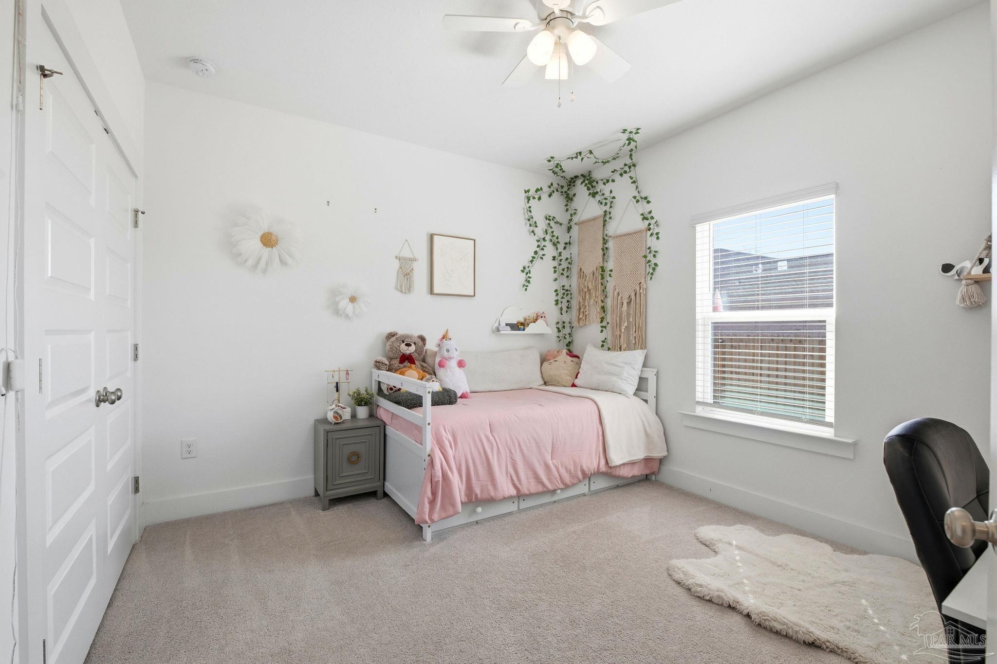 6228 Dry Crk Road Molino, FL 32577 - Photo 31 of 64 a bedroom with a bed and a chair