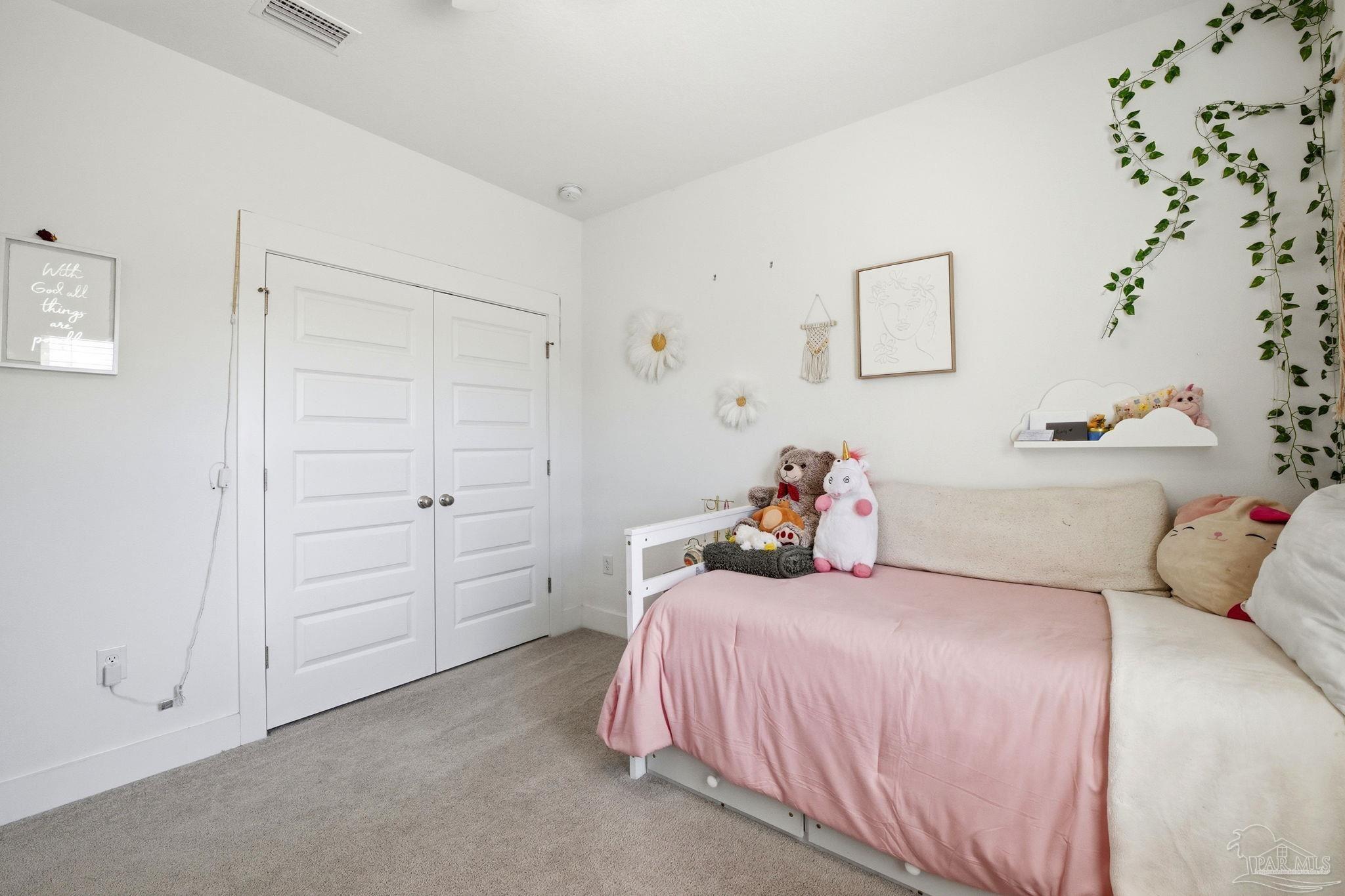 6228 Dry Crk Road Molino, FL 32577 - Photo 32 of 64 a bedroom with a bed and a cabinets