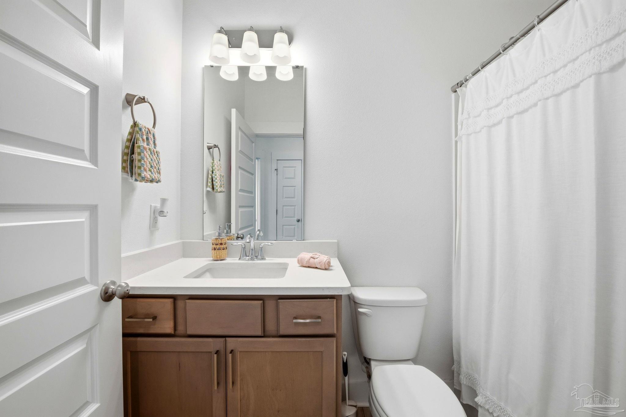 6228 Dry Crk Road Molino, FL 32577 - Photo 36 of 64 a bathroom with a sink toilet and mirror