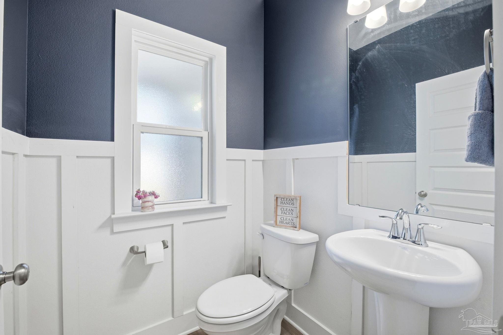 6228 Dry Crk Road Molino, FL 32577 - Photo 38 of 64 a bathroom with a sink toilet and a mirror