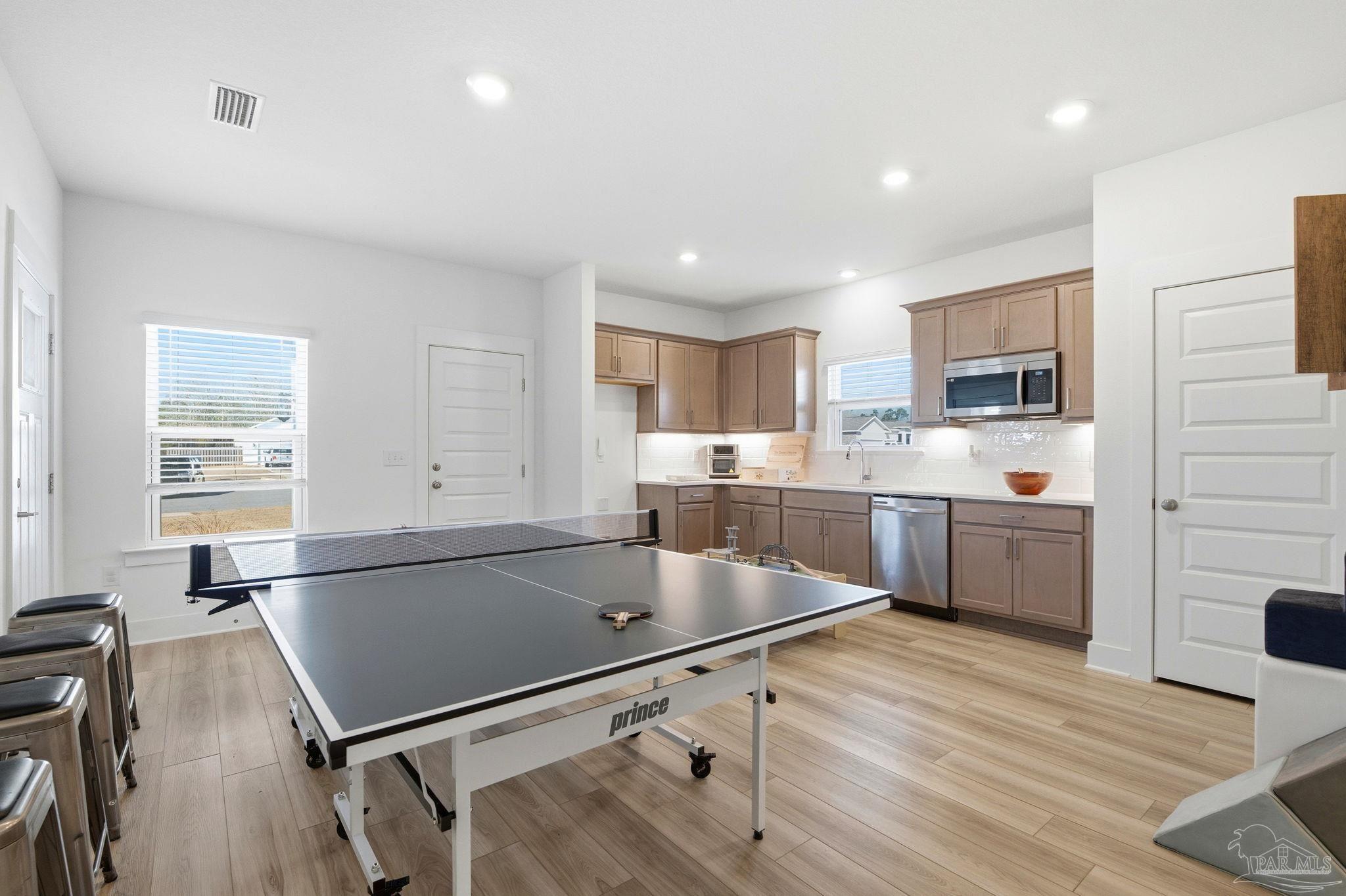 6228 Dry Crk Road Molino, FL 32577 - Photo 39 of 64 a kitchen with stainless steel appliances granite countertop a sink counter space and cabinets