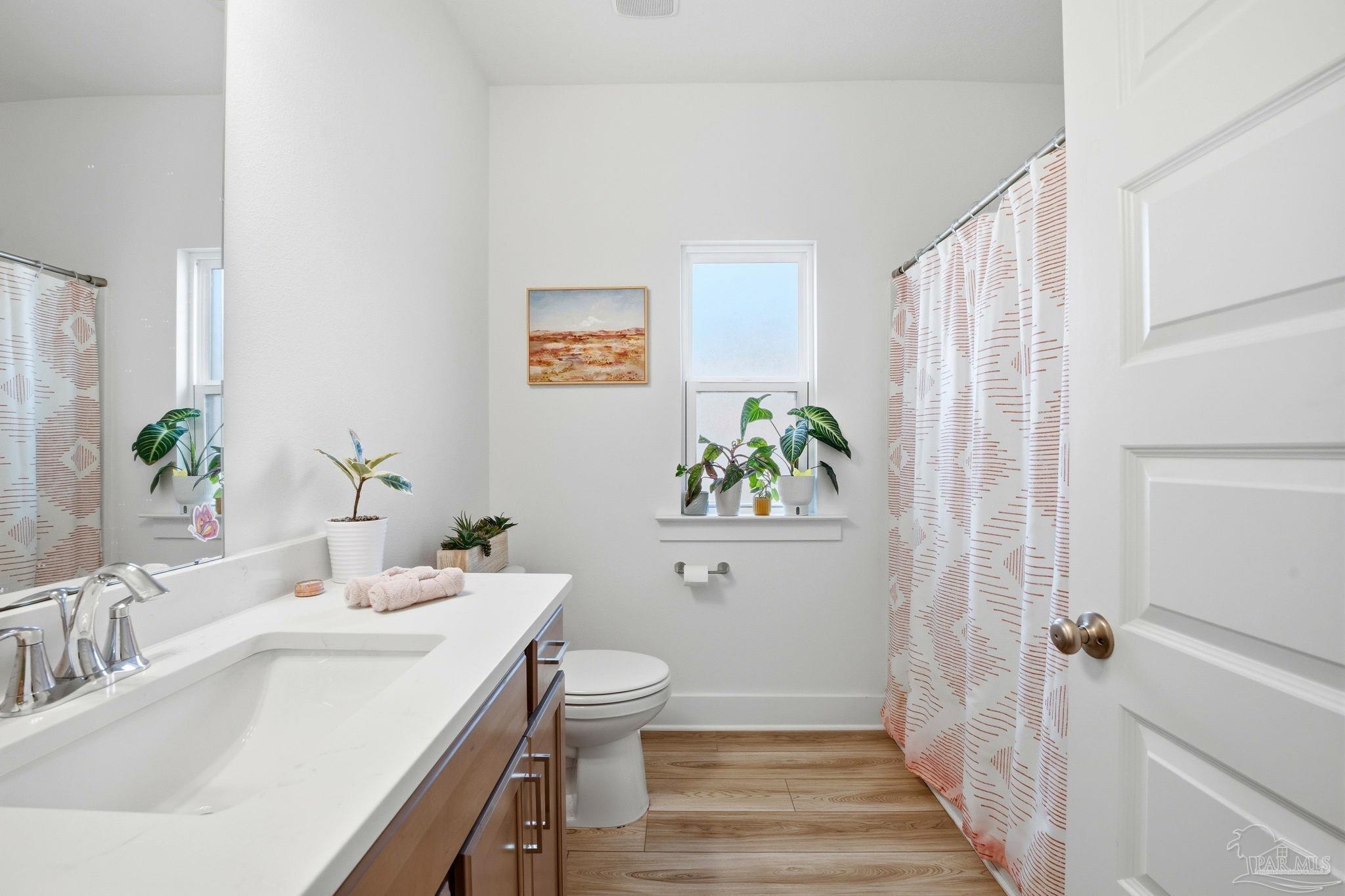 6228 Dry Crk Road Molino, FL 32577 - Photo 45 of 64 a bathroom with a sink and a toilet