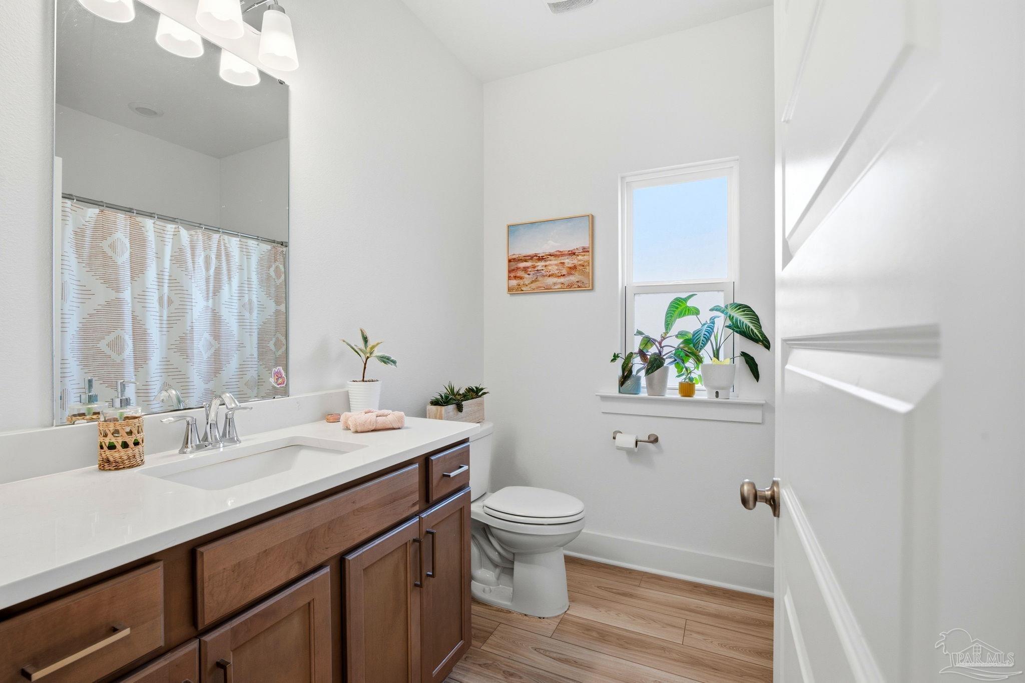 6228 Dry Crk Road Molino, FL 32577 - Photo 46 of 64 a bathroom with a sink a toilet and a mirror