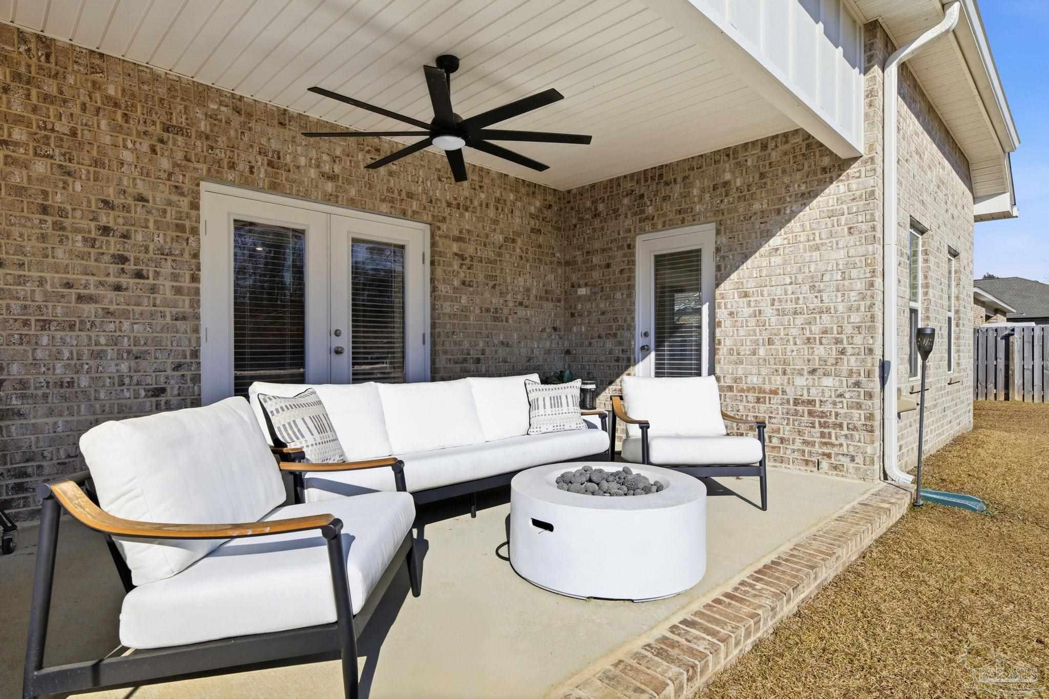 6228 Dry Crk Road Molino, FL 32577 - Photo 49 of 64 a living room with fireplace furniture and a rug