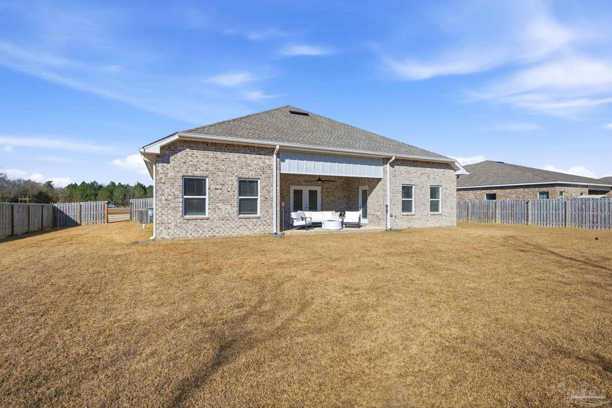 6228 Dry Crk Road Molino, FL 32577 - Photo 52 of 64 a front view of a house with a garden