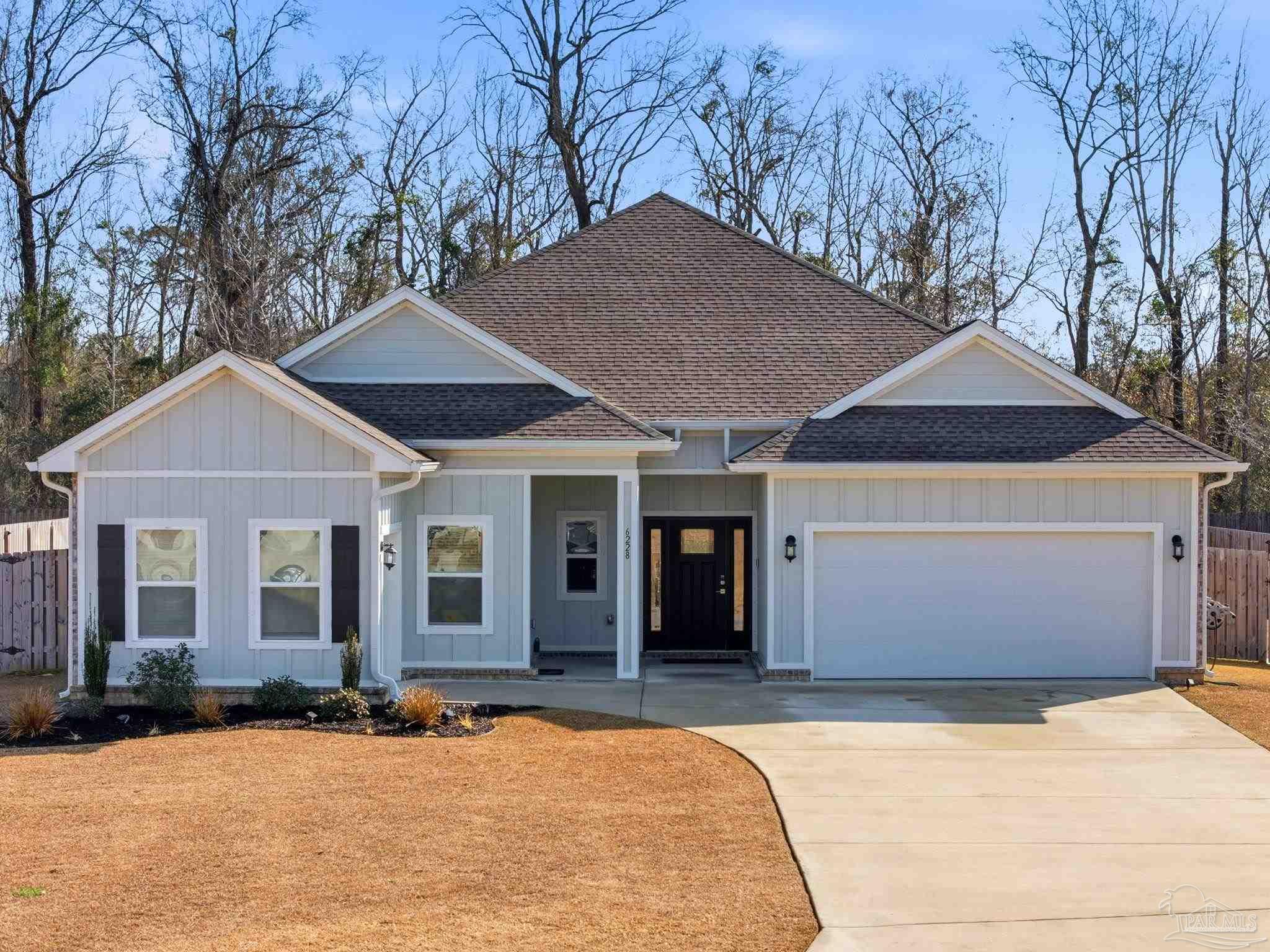 6228 Dry Crk Road Molino, FL 32577 - Photo 53 of 64 a front view of a house with a yard