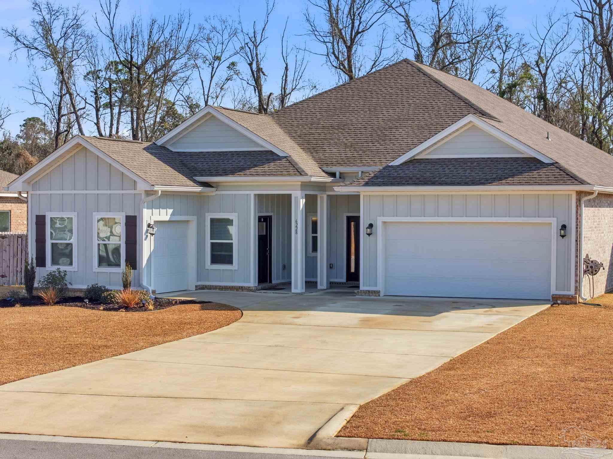 6228 Dry Crk Road Molino, FL 32577 - Photo 64 of 64 a front view of a house with a yard