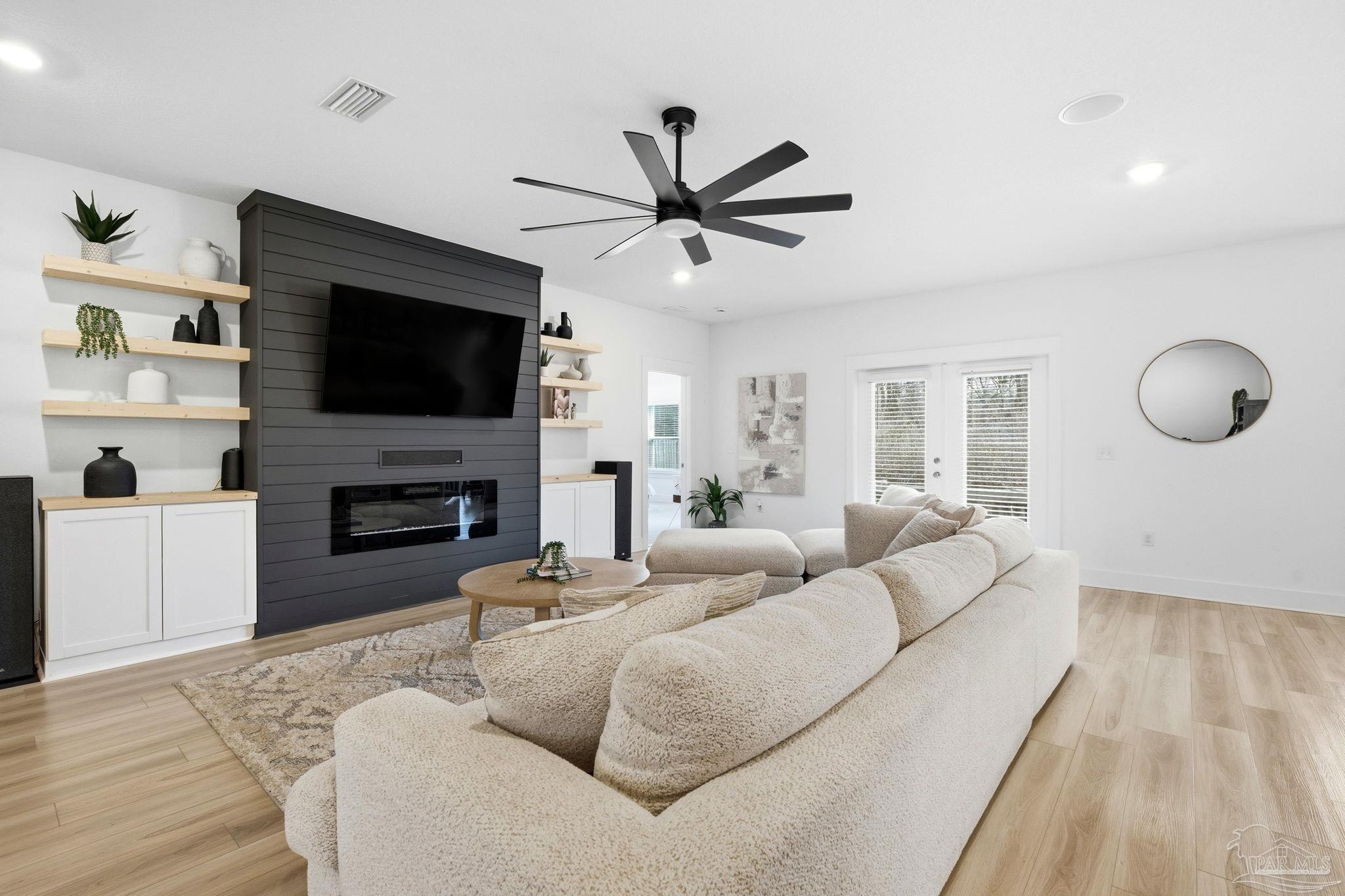 6228 Dry Crk Road Molino, FL 32577 - Photo 8 of 64 a living room with furniture a fireplace and a flat screen tv