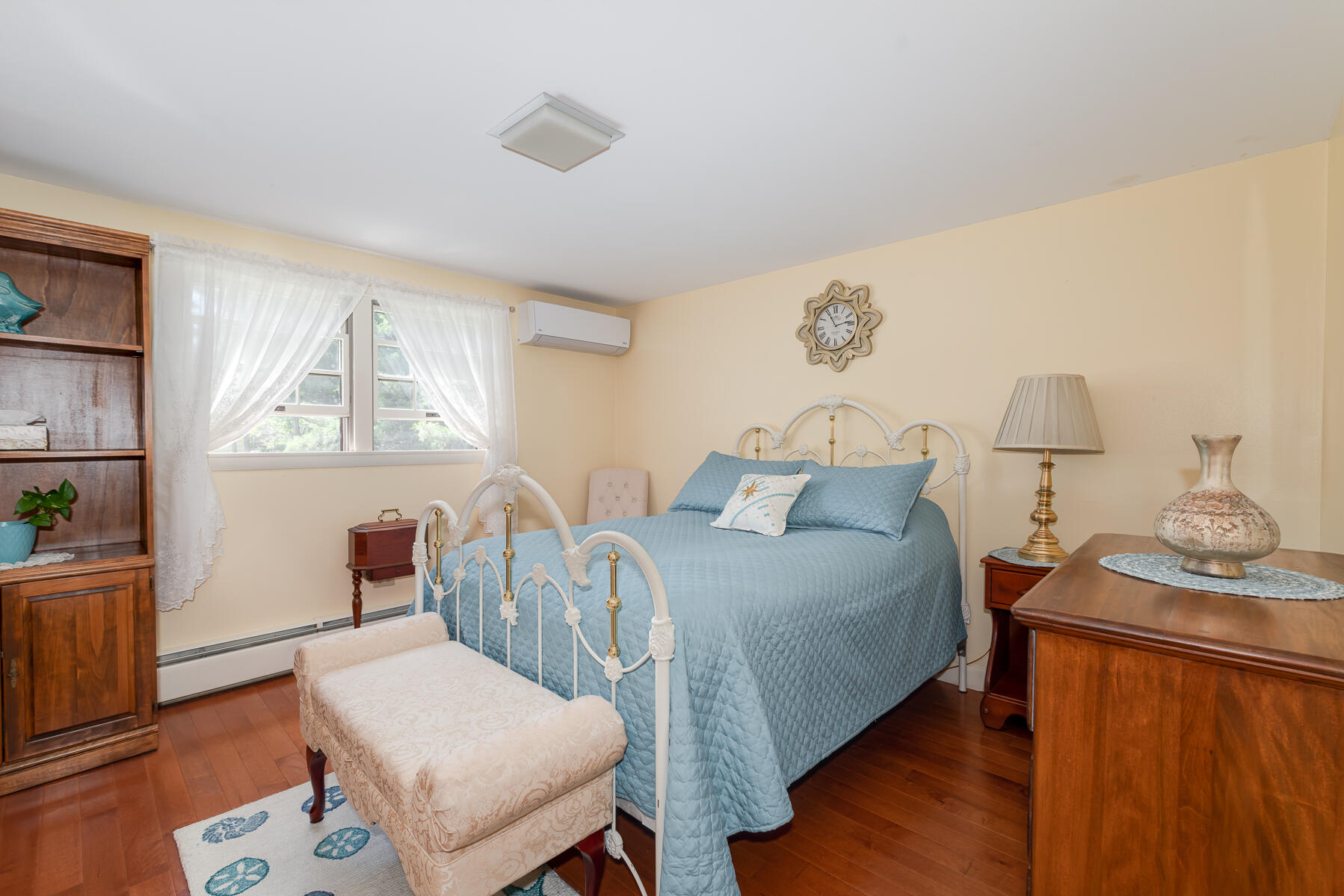 129 Bacon Road Hyannis, MA 02601 - Photo 13 of 43 a bedroom with a bed and wooden floor
