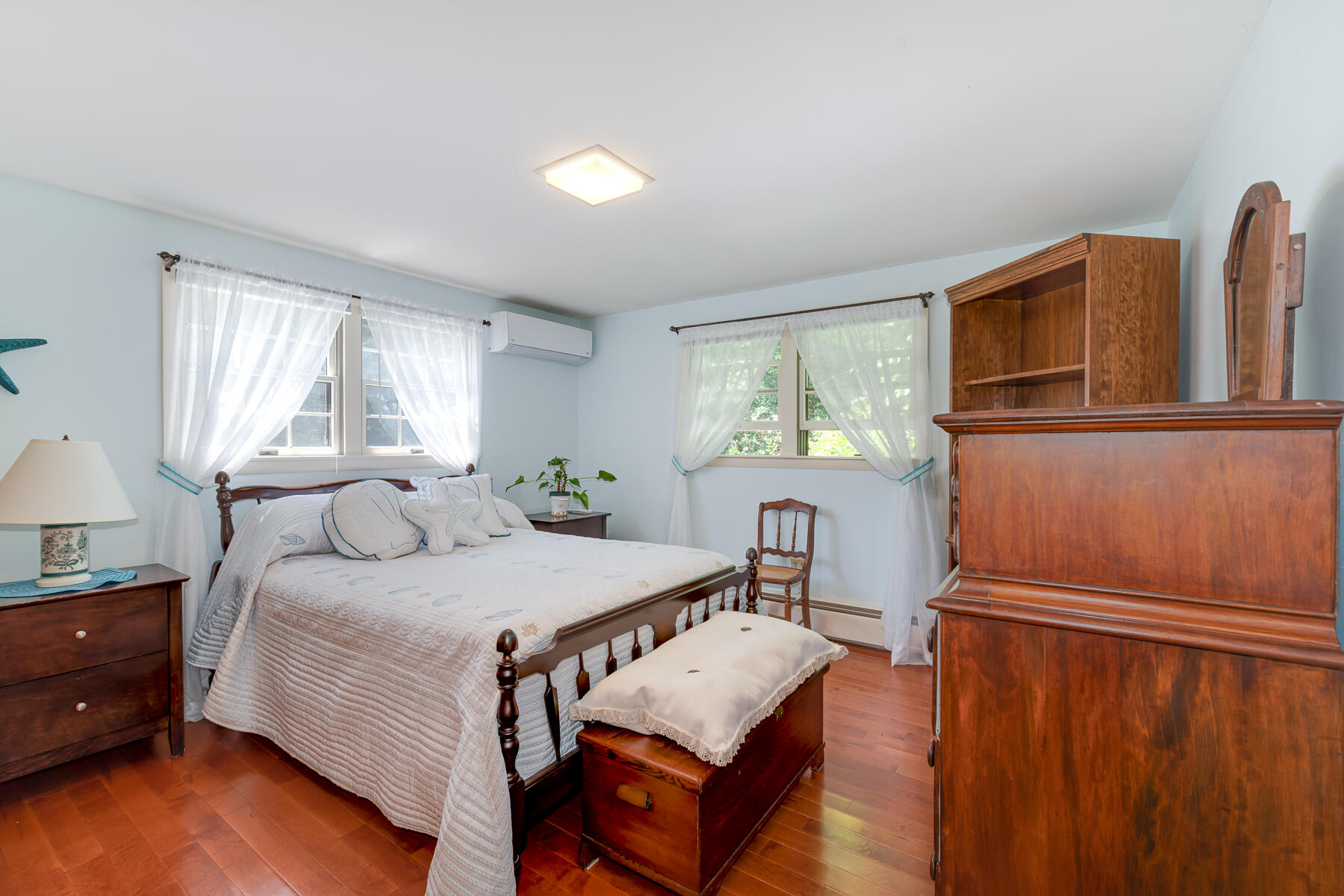 129 Bacon Road Hyannis, MA 02601 - Photo 15 of 43 a bedroom with a bed and wooden floor