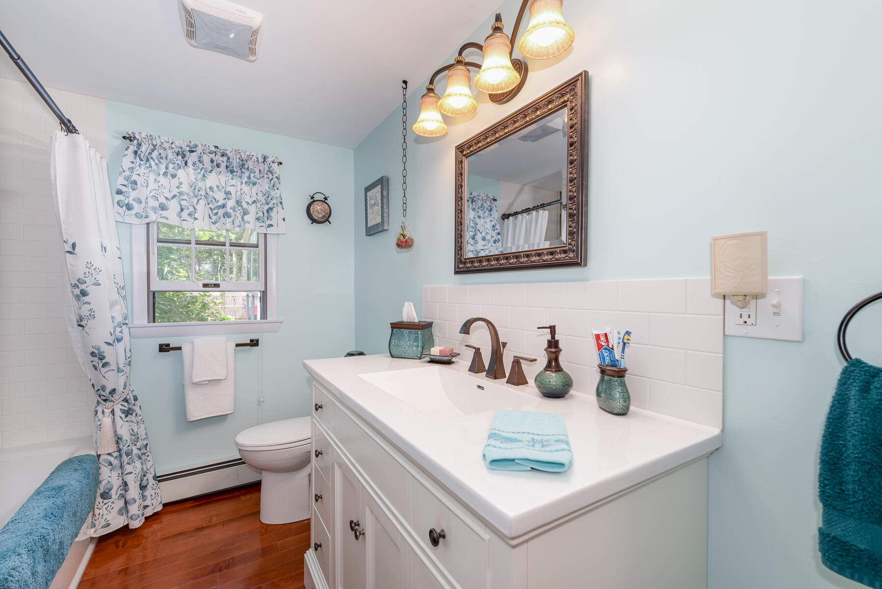 129 Bacon Road Hyannis, MA 02601 - Photo 19 of 43 a bathroom with a sink mirror vanity and toilet