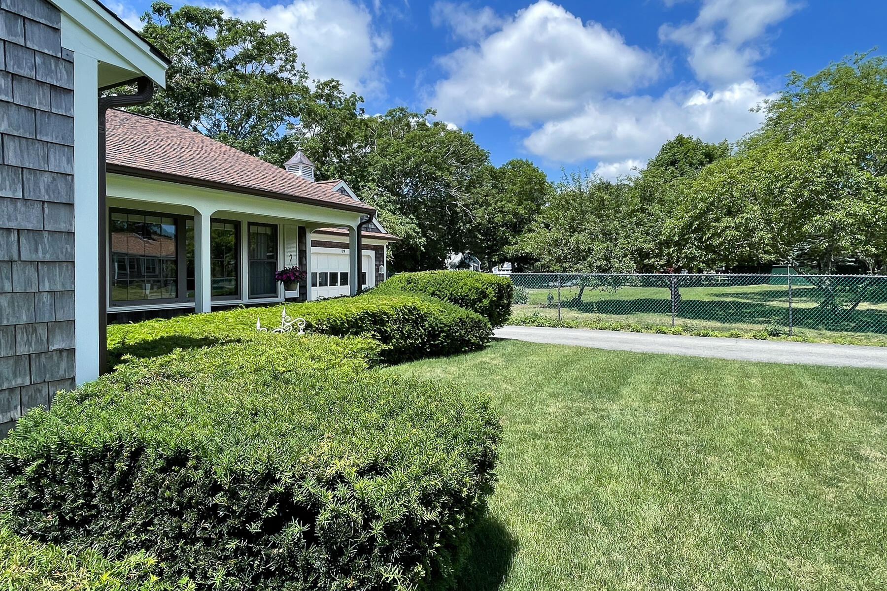 129 Bacon Road Hyannis, MA 02601 - Photo 2 of 43 a view of a house with a garden
