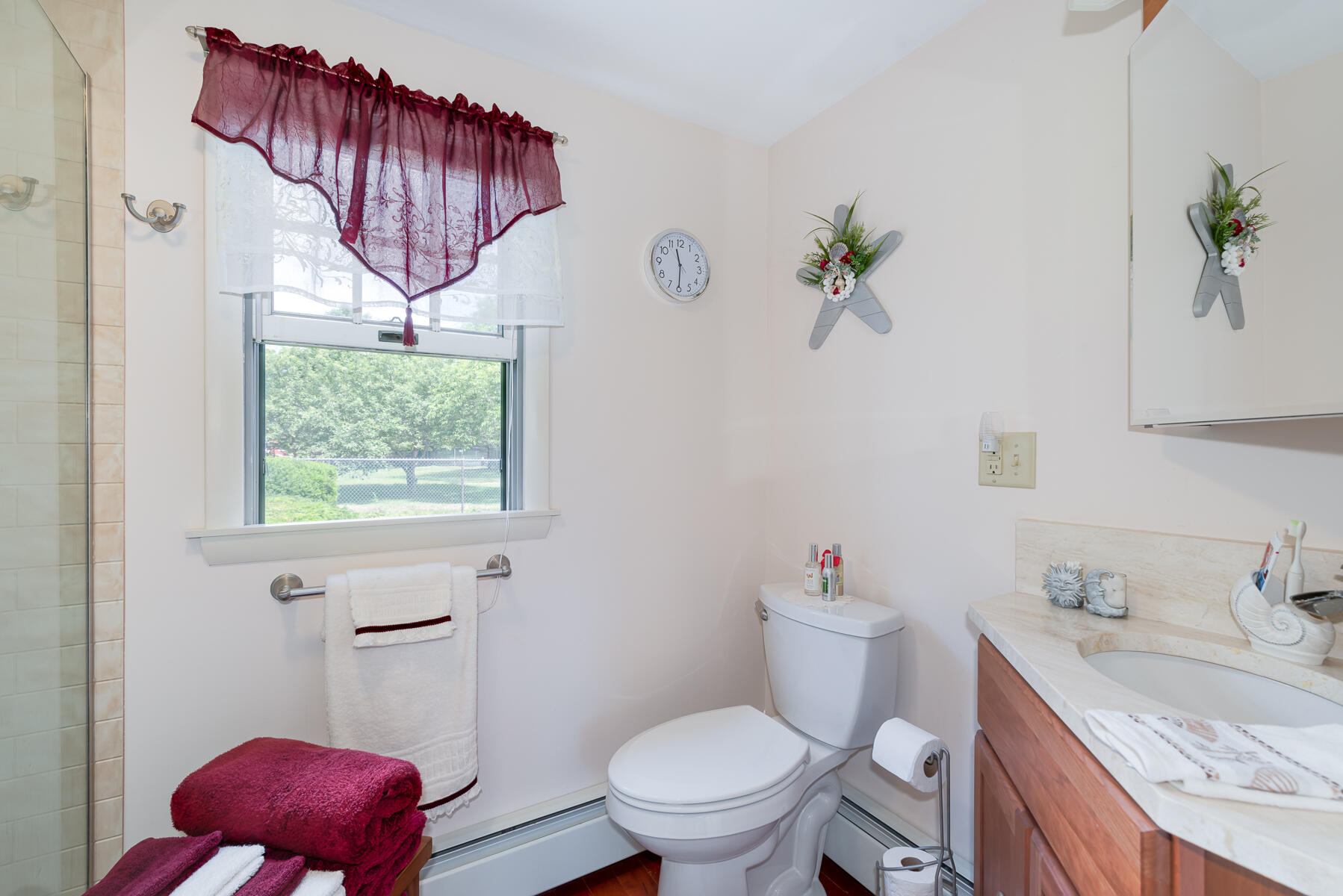 129 Bacon Road Hyannis, MA 02601 - Photo 23 of 43 a bathroom with a granite countertop toilet sink and mirror