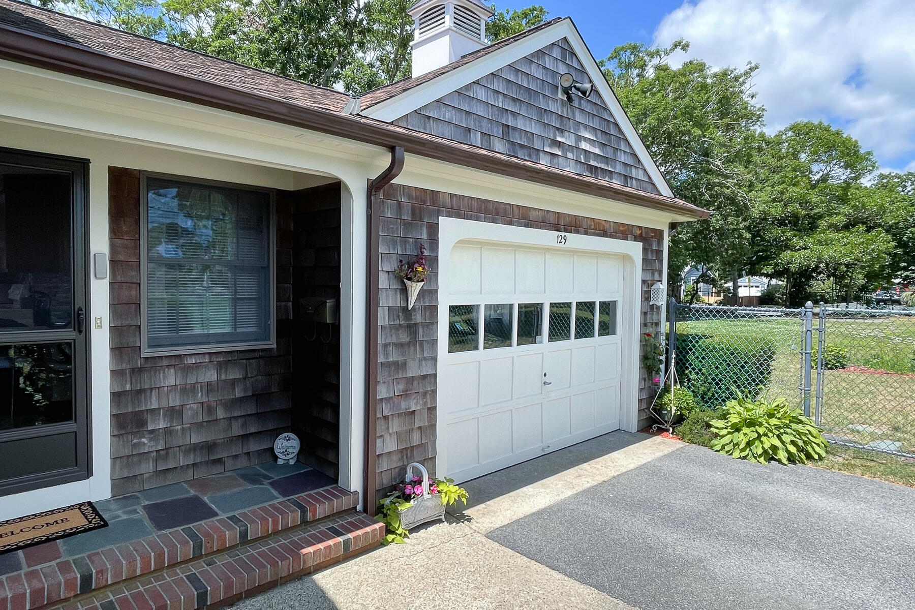 129 Bacon Road Hyannis, MA 02601 - Photo 29 of 43 a front view of a house with a yard