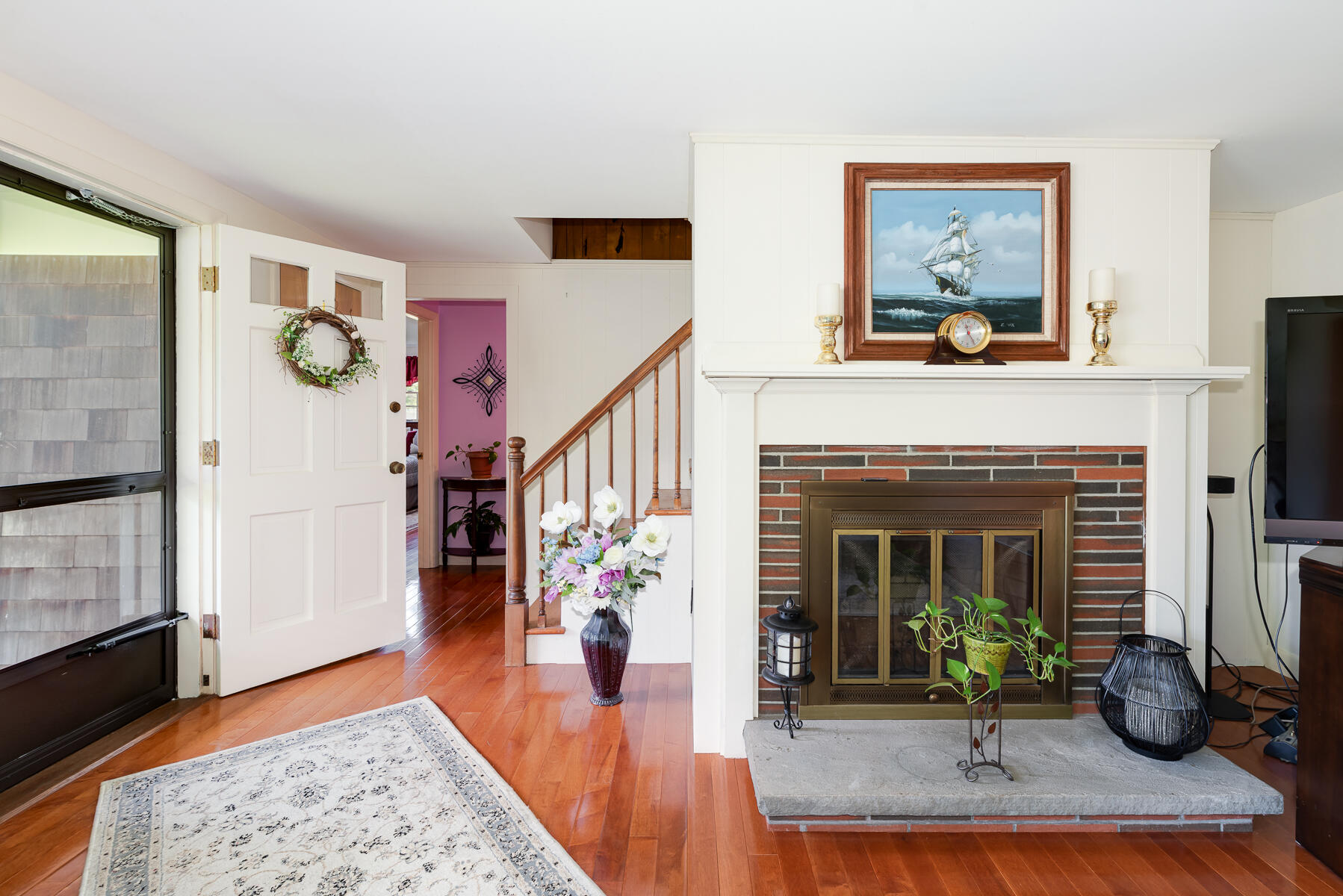 129 Bacon Road Hyannis, MA 02601 - Photo 3 of 43 a living room with furniture and a fireplace