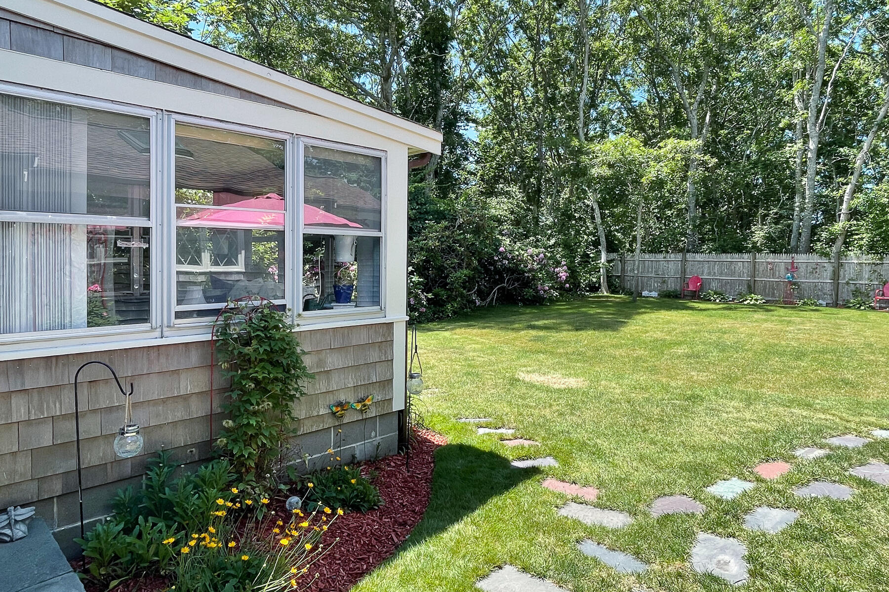 129 Bacon Road Hyannis, MA 02601 - Photo 40 of 43 a view of a house with backyard and porch