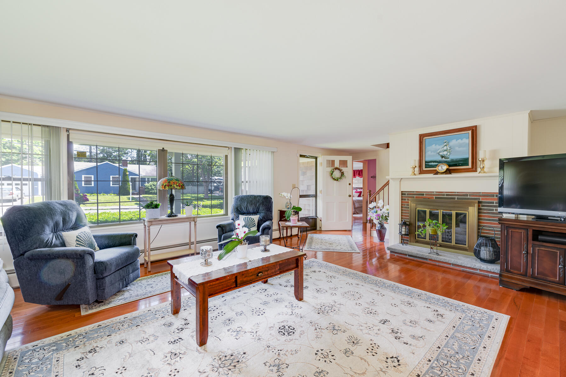 129 Bacon Road Hyannis, MA 02601 - Photo 4 of 43 a living room with furniture and a flat screen tv