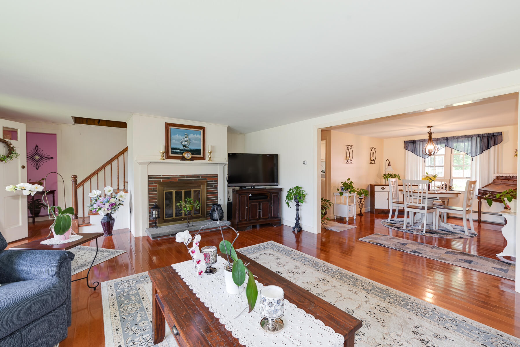 129 Bacon Road Hyannis, MA 02601 - Photo 6 of 43 a living room with fireplace furniture and a flat screen tv