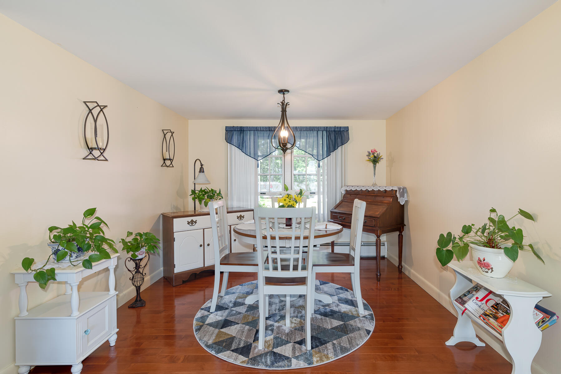 129 Bacon Road Hyannis, MA 02601 - Photo 7 of 43 a living room with furniture and a chandelier