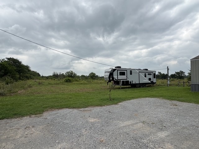 995 Diserens Road North Zulch, TX 77872 - Photo 4 of 23 Left side of home; place to park camper with power