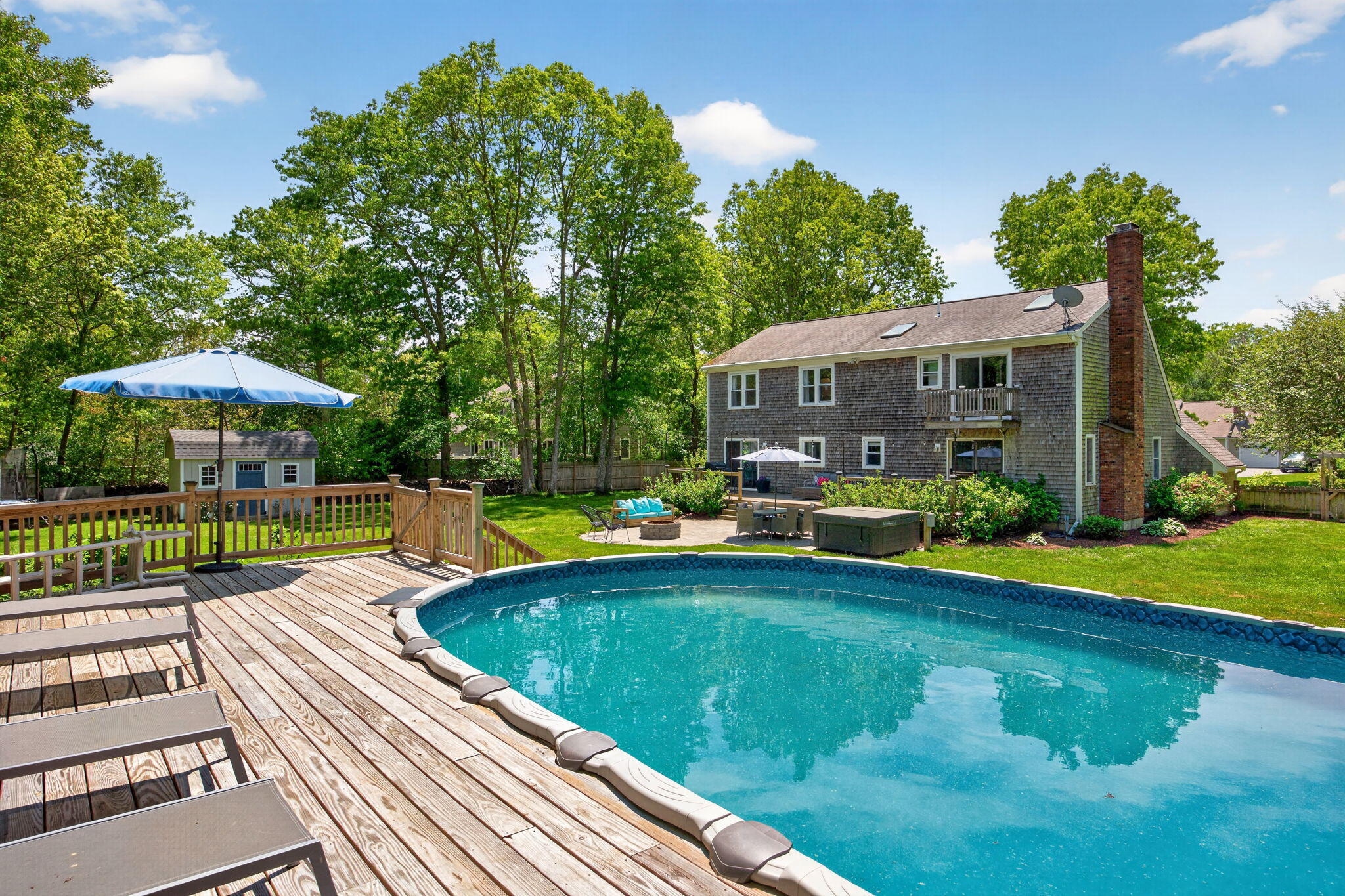 12 Sarah Lawrence Road Sandwich, MA 02563 - Photo 46 of 54 a view of a swimming pool with lounge chairs in the patio