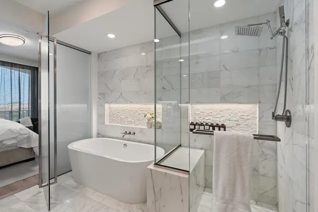 a bathroom with a bathtub and a shower