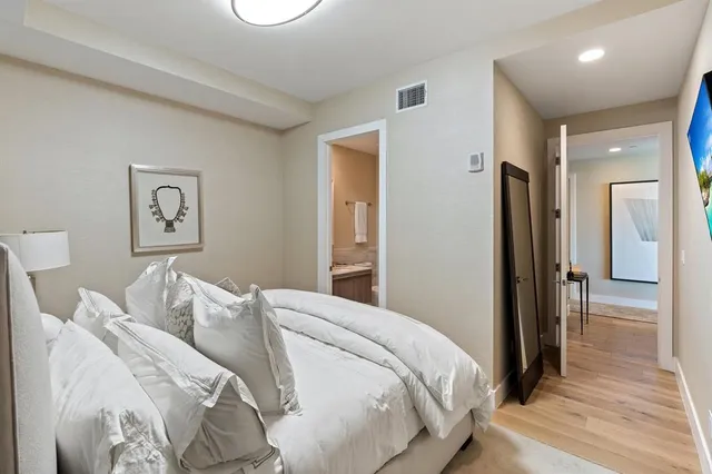 a bedroom with a bed and a walk in closet