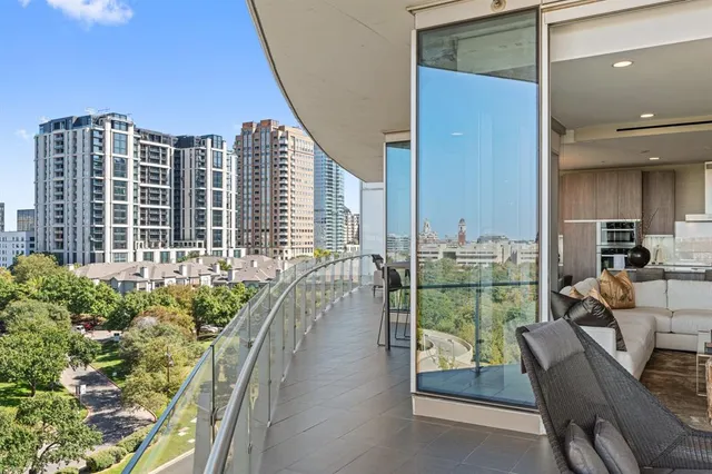 a view of a balcony with chairs