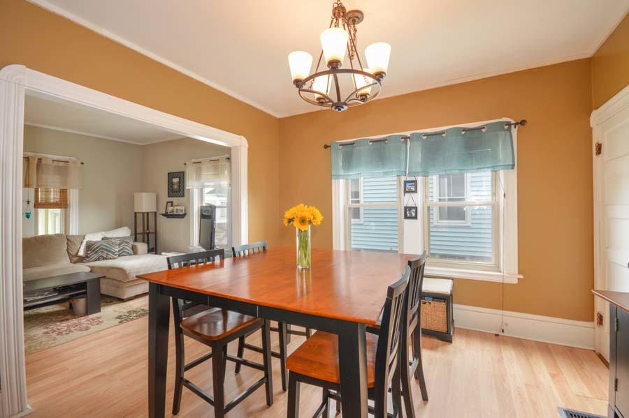 156 Rounds Street New Bedford, MA 02740 - Photo 10 of 24 a dining room with furniture and wooden floor