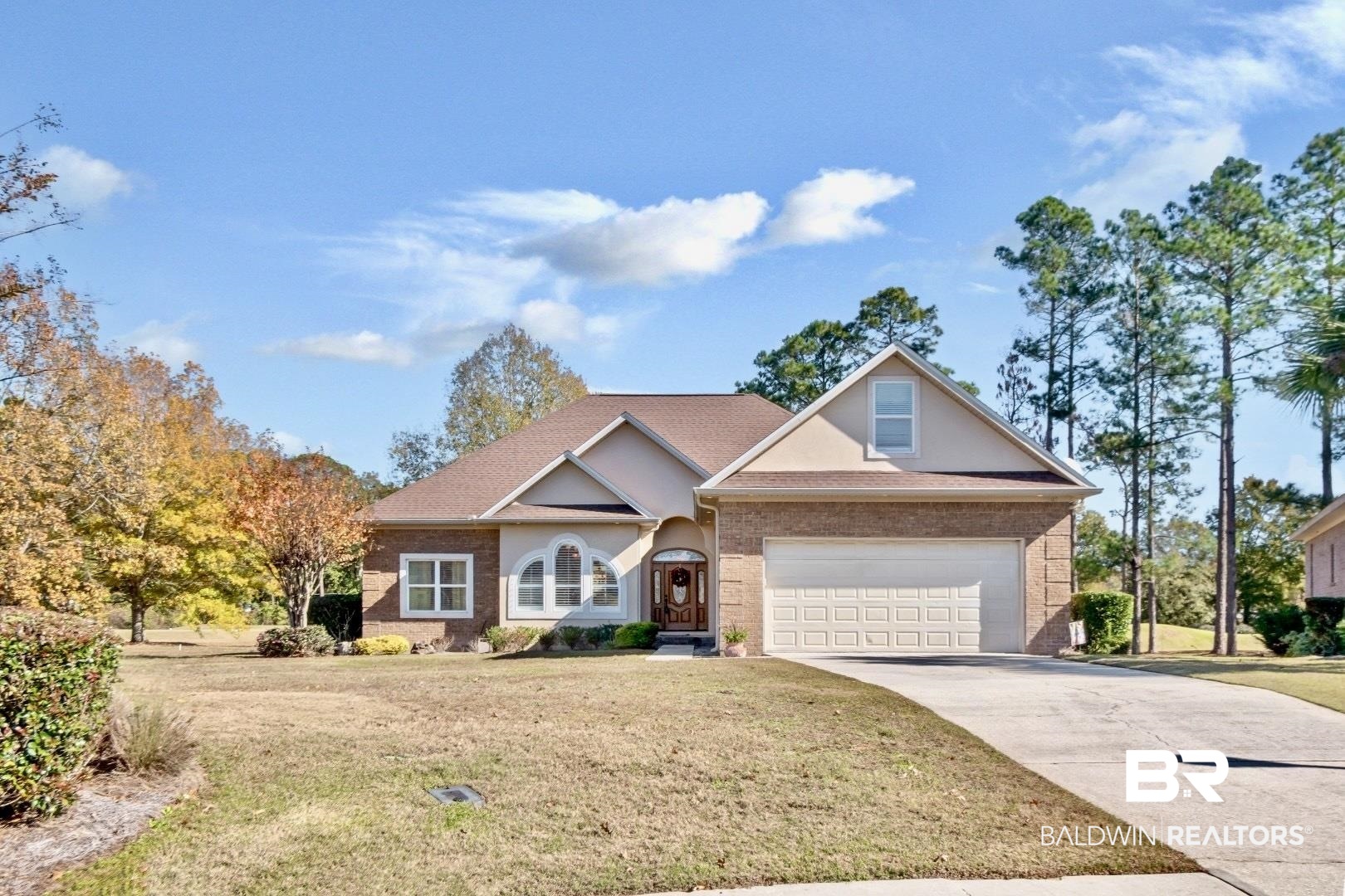 9905 Carnoustie Court Foley, AL 36535 - Photo 27 of 31 Traditional-style home with a front yard, driveway, a garage, and stucco siding