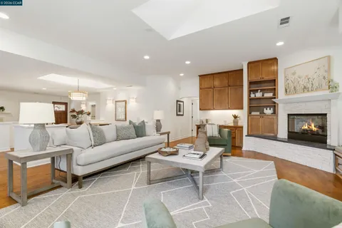 a bathroom with a sink vanity mirror and toilet