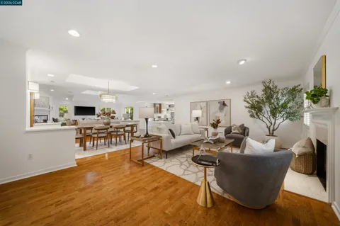 a kitchen with a table chairs refrigerator and microwave