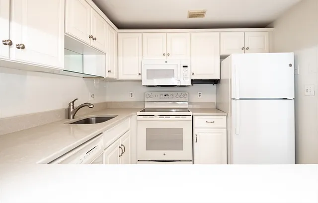 a view of a livingroom with furniture and window