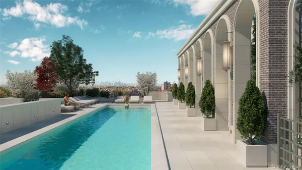 a view of swimming pool with outdoor seating and plants